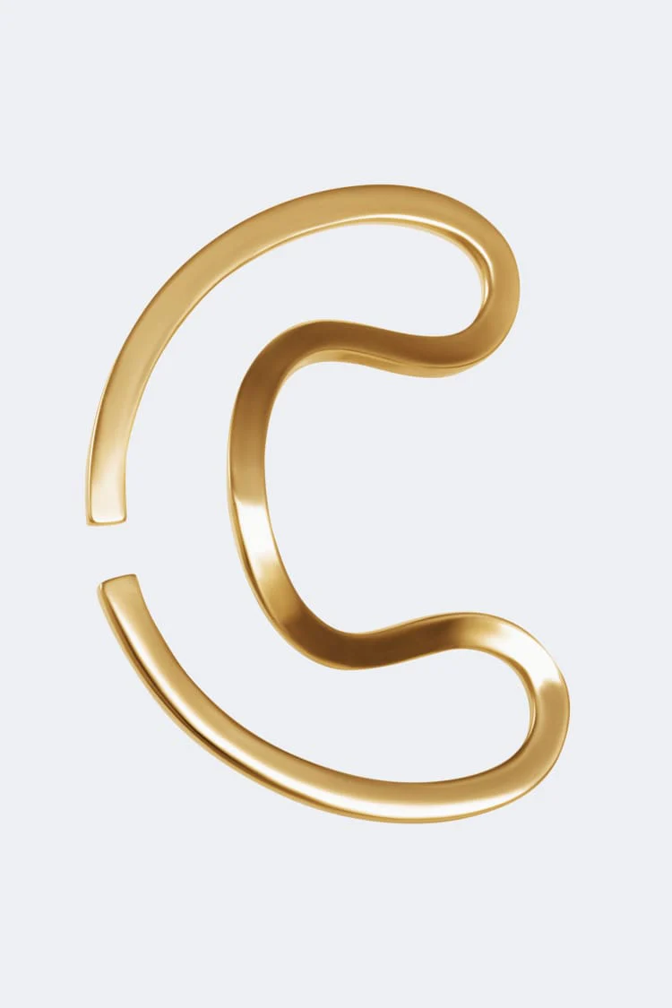 Gold ear cuff around the ear